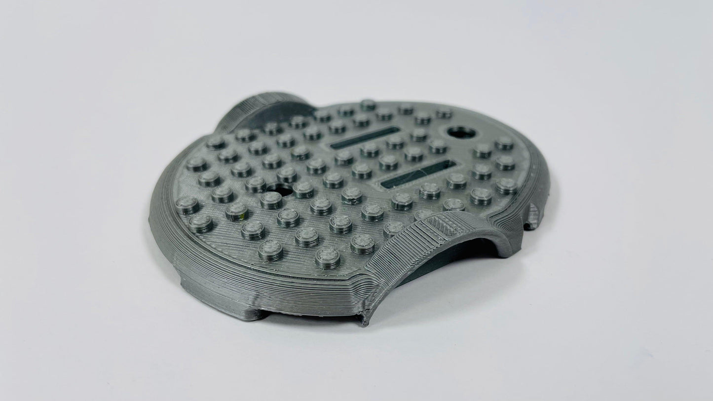 Coque pour brique de construction